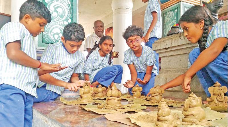 Children make clay Ganeshas with  seeds stuffed in the belly to be gifted to people.