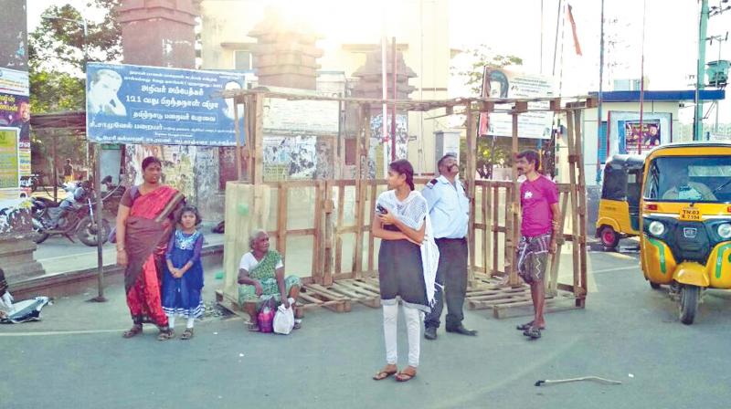 Commuters enjoy the cool shade of the  innovative bus stop. (Photo: DC)