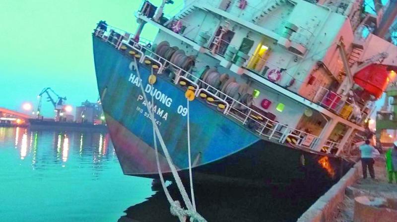 Vietnamese ship MV Hai Duong rests in a tilted position at Visakhapatnam Port a day after a faulty loading.