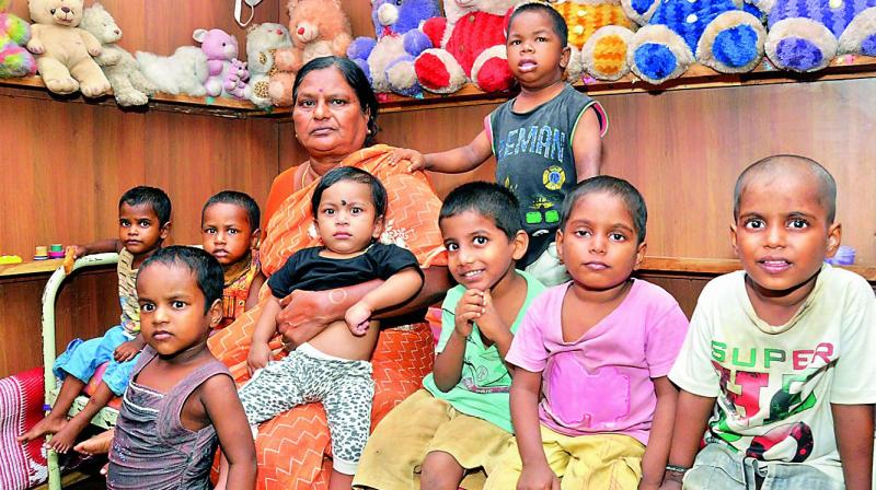 Abandoned and differently-abled kids in a playful mood with the caretaker of Pragathi Charities, a home for orphan and abandoned children in Nellore on Thursday (Photo: DC)