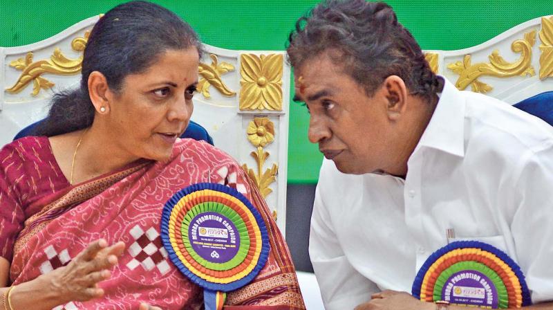 Union Defence minister Nirmala Sitharaman has a word with minister S.P. Velumani during the inaugural of the Mudra loan campaign on Saturday.