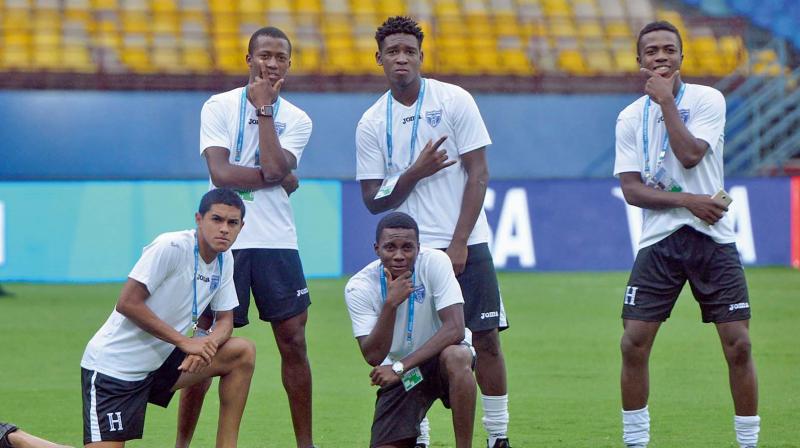 Honduras players pose ahead of their training session at the Jawaharlal Nehru International Stadium in Kochi on Tuesday, the eve of their round of 16 match against Brazil. (Photo: SUNOJ NINAN MATHEW)
