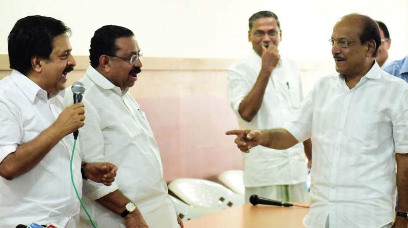 KPCC president M.M. Hassan and leader of opposition Ramesh Chennithala interacts with P.K. Kunhalikutty, MP, during the UDF north zone meet in Kozhikode on Wednesday (Photo: VENUGOPAL)