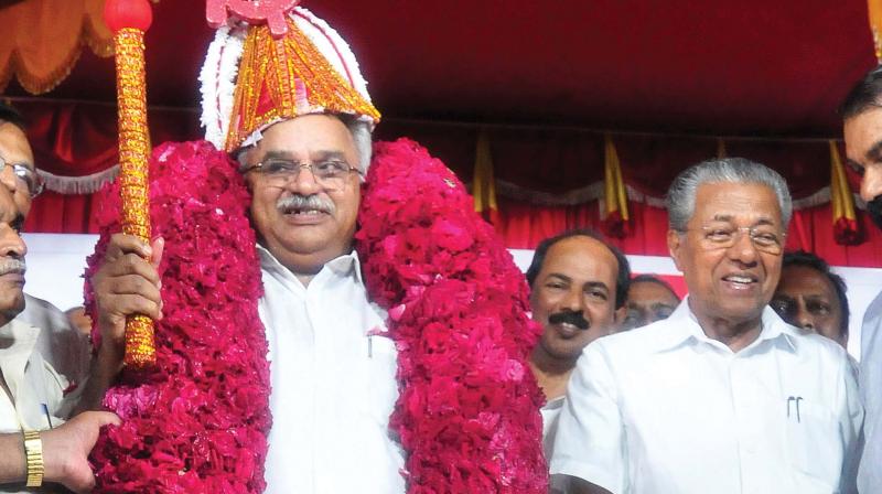 CPI state secretary and LDF jana jagrata yatra Thiruvananthapuram-Ernakulam leg captain Kanam Rajendran feted with a red garland and sickle and hammer headgear at the yatra inauguration by Chief Minister Pinarayi Vijayan in Thiruvananthapuram on Saturday (Photo: A.V.MUZAFAR)