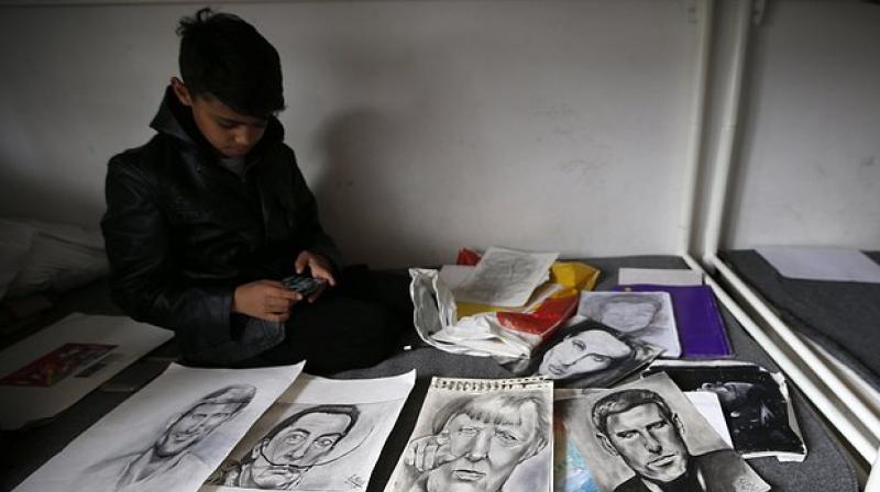 Among Nouris works exhibited in the garden of a Belgrade cafe were his drawings of Pablo Picasso, Salvador Dali and Harry Potter. (Photo: AP)