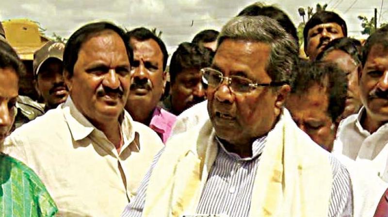 A file photo of Chief Minister Siddaramaiah with his aide Mari Gowda (left)