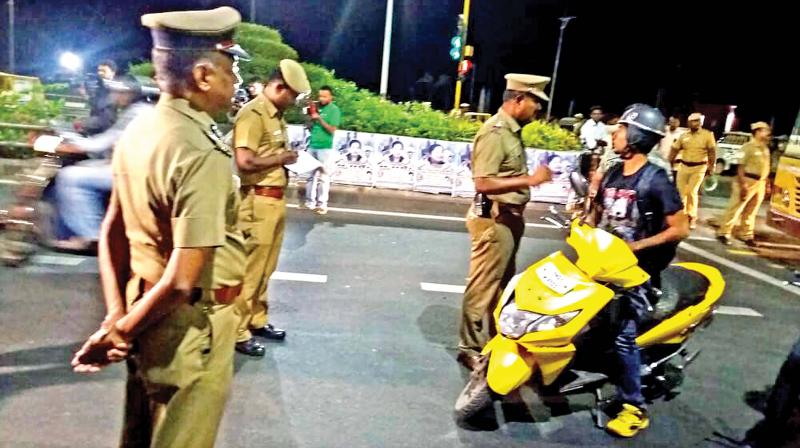 City police  commissioner A. K. Viswanathan oversees the storming  operation near Marina Beach, on Thursday night. (Photo:DC)