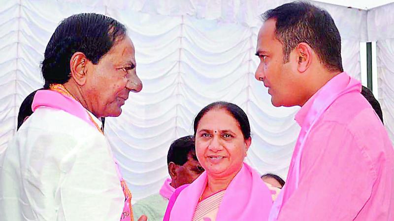 Chief Minister K. Chandrasekhar Rao speaks with former TD leaders Uma Madhava Reddy and her son Sandeep Reddy who joined the TRS at Telangana Bhavan in Hyderabad on Thursday. (Photo: DC)