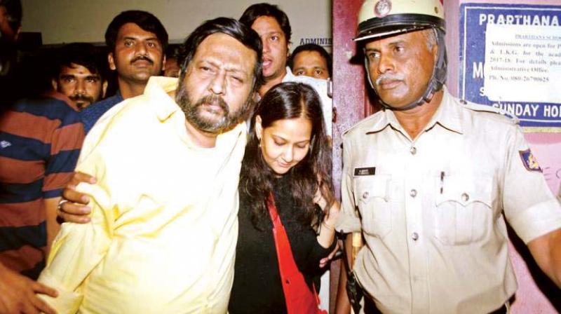 A file photo of Ravi Belagere in police custody.