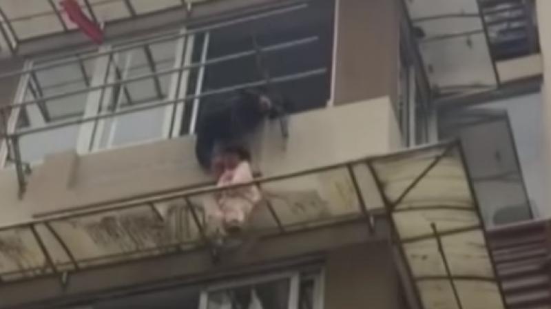The child was left unsupervised and fell out of the window ending up on the awning which was broken. (Photo: Youtube/CCTV+)
