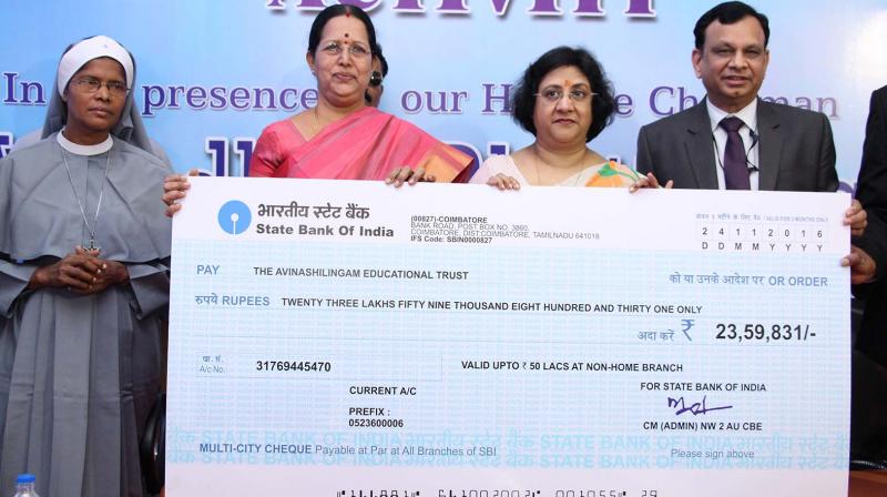 Chairman of State Bank of India, Arundhati Battacharya, provides financial assistance for educational institutions in Coimbatore on Thursday as part of Corporate Social Responsibility initiative. (Photo: DC)