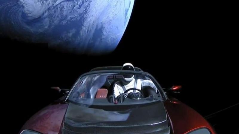 The image shows the companys spacesuit in Elon Musks red Tesla sports car which was launched into space during the first test flight of the Falcon Heavy rocket.