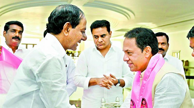 Former speaker K.R. Suresh Reddy greets TRS chief and caretaker Chief Minister K. Chandrasekhar Rao after joining the party on Wednesday.