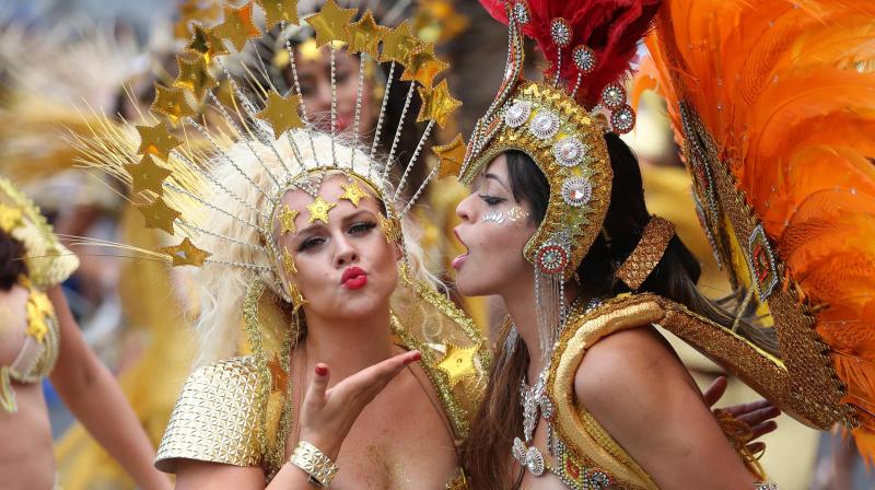 Notting Hill Carnival revellers strut their stuff in elaborate Caribbean costumes Notting Hill Carnival revellers strut their stuff in elaborate Caribbean costumes