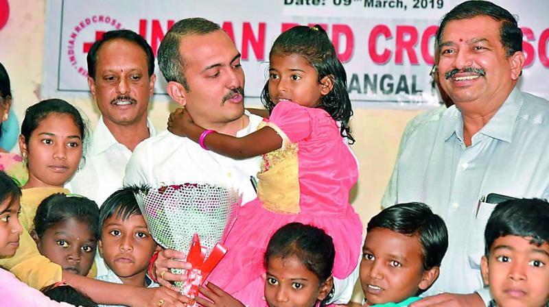 Above: District collector and president of IRCS, Warangal interacts with children suffering from thalassemia. Right: The iron chelation pump syringe
