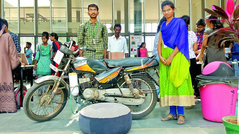 Students display the prototype of their idea, SRS airbags for two-wheelers during the expo, on Saturday. 	DC