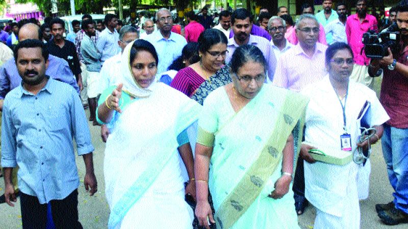 Kerala Womens Commission chairperson M. C. Josephine and member Shahida Kamal arrive at SAT Hospital in Thiruvananthapuram on Tuesday to receive the AIDS affected newborn and mother who were later sent to Gandhi Bhavan in Pathanapuram. (Photo: A.V. MUZAFAR)