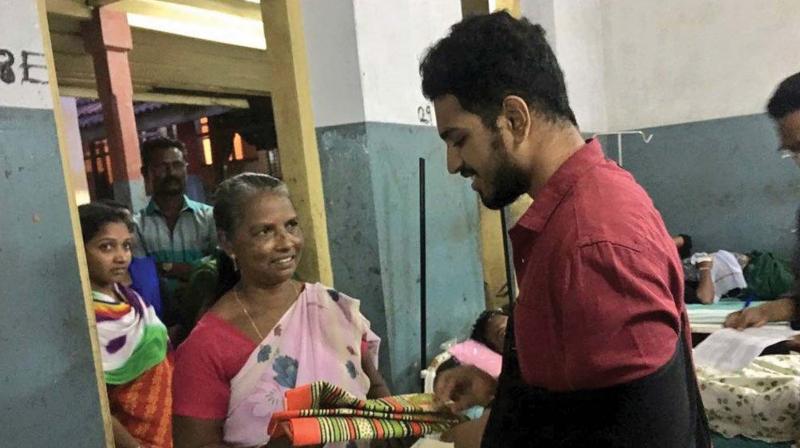 DYFI Vellayambalam unit member Rushabh Mohan donates blankets to fishermen injured in cyclone Ockhi at Thiruvananthapuram General Hospital on Tuesday.