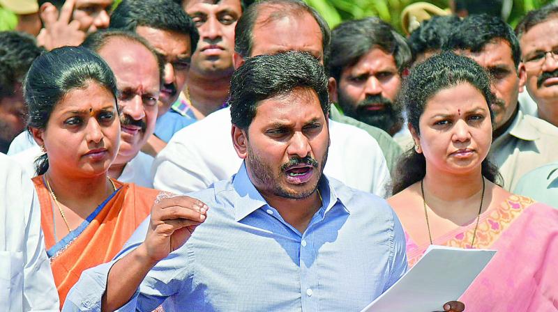 YSRC president Y.S. Jagan Mohan Reddy speaks to the media with party leaders after submitting a representation to Governor E.S.L. Narasimhan on the deteriorating law and order situation in AP. (Photo: DC)