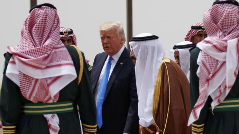 US President Donald Trump, center left, walks with Saudi King Salman, center right, during a welcome ceremony at the Royal Terminal of King Khalid International Airport. (Photo: AP)