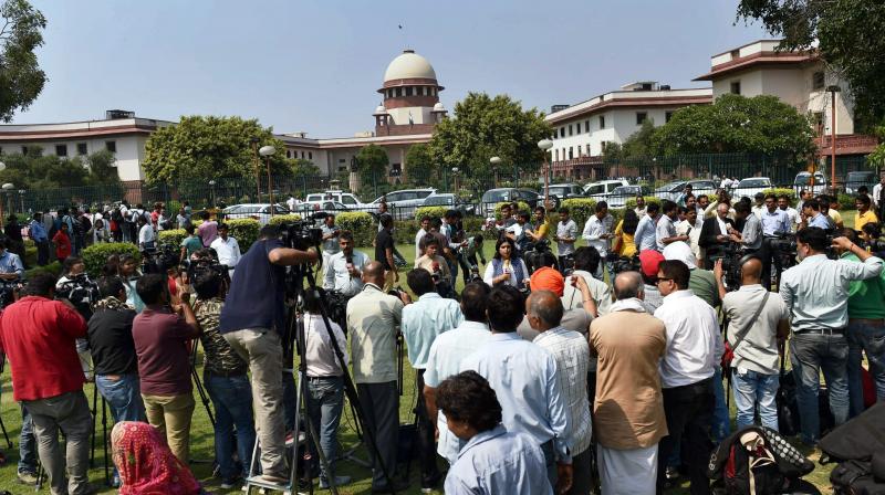 Media outside the Supreme Court that confirmed death sentence for the four convicts in Nirbhaya gang rape case in New Delhi. (Photo: PTI)