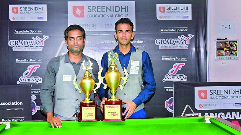 Champion Lucky Vatnani (right) and runner-up Rajiv Inuganti pose with their trophies at the Telangana Open Snooker Championship which concluded in Hyderabad on Sunday.