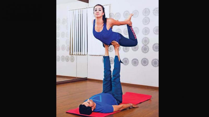 Actress Sanjjanaa Galrani working out with a trainer. Used for representational  purposes only.
