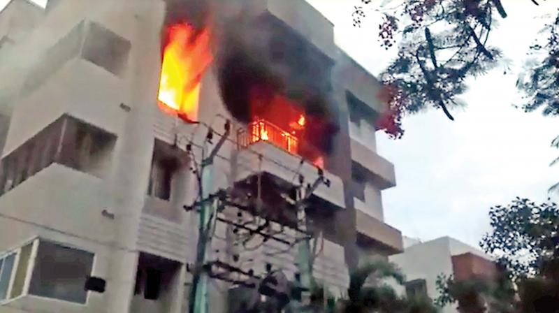 Flames leap out of the third floor of the service apartment in Saidapet. (Photo:DC)