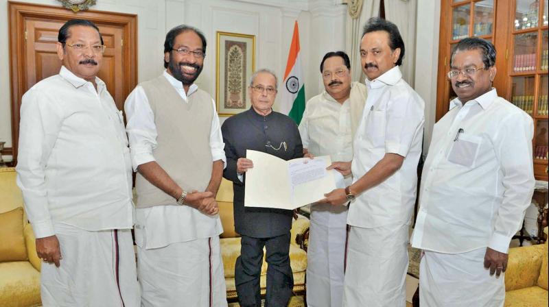 DMK leader M.K. Stalin submits a petition to President Pranab Mukherjee in New Delhi on Thursday. (Photo: DC)