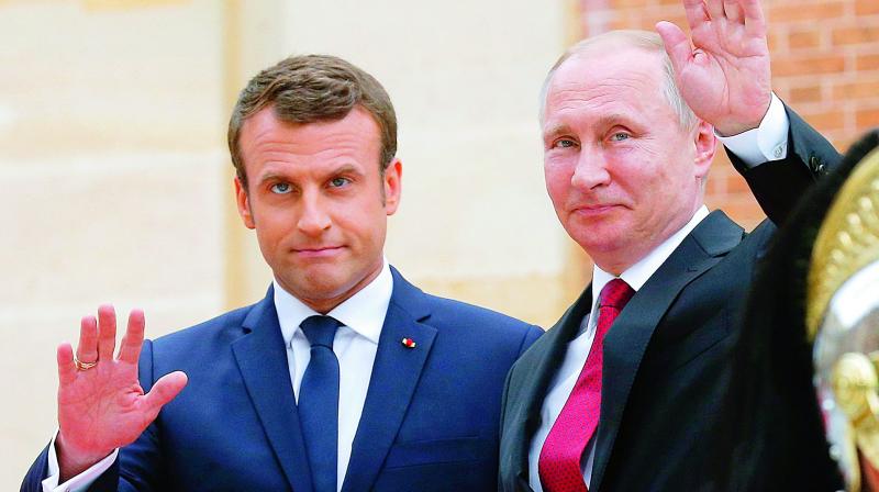 Russian President Vladimir Putin (right) and French President Emmanuel Macron at the Versailles Palace, near Paris on Monday. (Photo: AP)