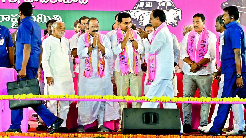 Senior RTS leaders, including his son and caretaker minister K.T. Rama Rao, greet party chief and caretaker Chief Minister K. Chandrasekhar Rao at a meeting on Parade Ground in Hyderabad on Sunday.  (S. Surrender Reddy)