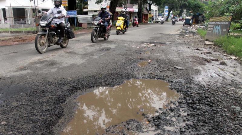 Potholed Kunnara Park road.