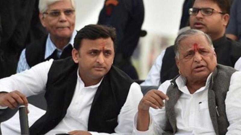 Samajwadi party chief Akhilesh Yadav and Mulayam Singh Yadav (Photo: PTI/File)