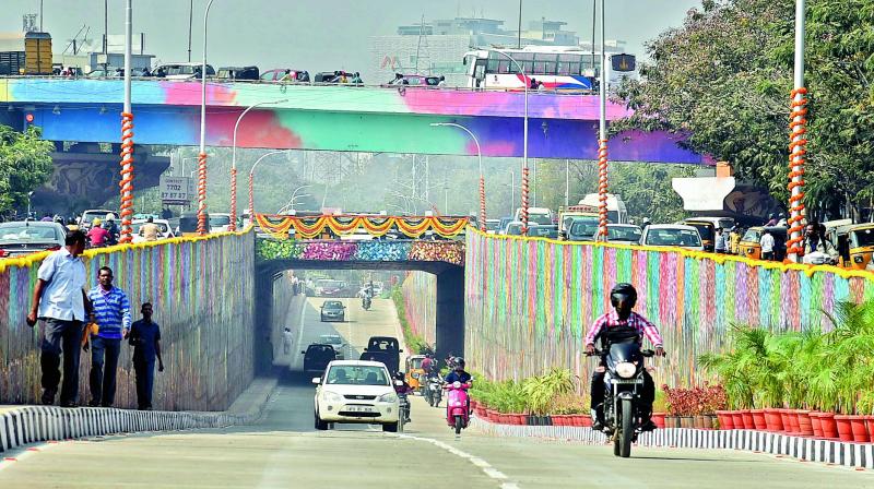 Motorists and pedestrians pass through the underpass road at Hi-Tech City after its inauguration on Wednesday. (Photo: DC)