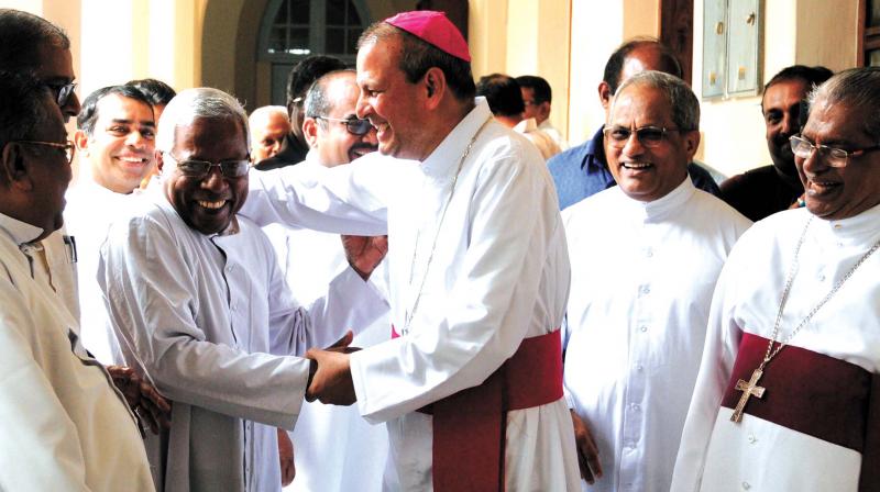 Joseph Kalathiparambil, the archbishop designate of Varapuzha archdiocese interacts with priests at the Bishops House in Kochi on Thursday. Francis Kallarackal, the incumbent archbishop of Varapuzha archdiocese is also seen. (Photo: ARUNCHANDRA BOSE)