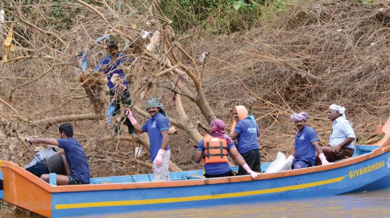 Volunteers of Fight for Life on a cleaning mission in the Panamaram River, Wayanad. File pic