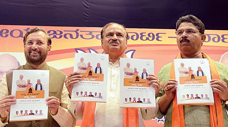 Union Ministers Prakash Javadekar and Ananth Kumar with MLA R. Ashok releasing BJP manifesto for Bengaluru for the forthcoming assembly election on Tuesday 	(Image: DC)