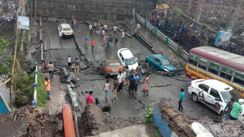 The bridge, which passes above the railway tracks, collapsed around 4:30 pm and vehicles crashed on the slums located next to the bridge. (Photo: Deccan Chronicle)