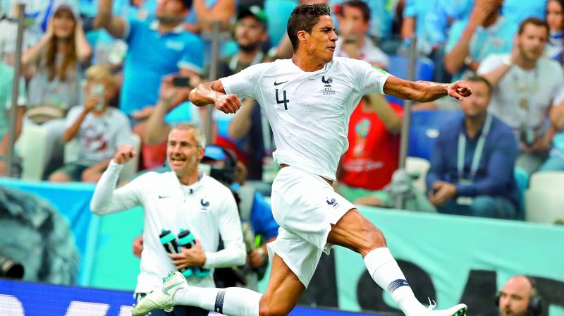 Raphael Varane of France celebrates after scoring his sides opening goal in the quarterfinal against Uruguay on Friday.	 (Photo:AP)