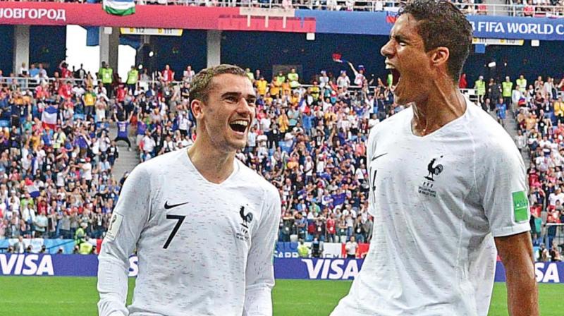 Frances Raphael Varane (right) celebrates with Antoine Griezmann after scoring the opener against Uruguay in the World Cup quarter-final at the Nizhny Novgorod Stadium on Friday. (Photo:AFP)