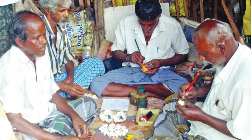Artisans work on seashells at Rameswaram. Sangus with names inscribed on them. (Photo: DC)