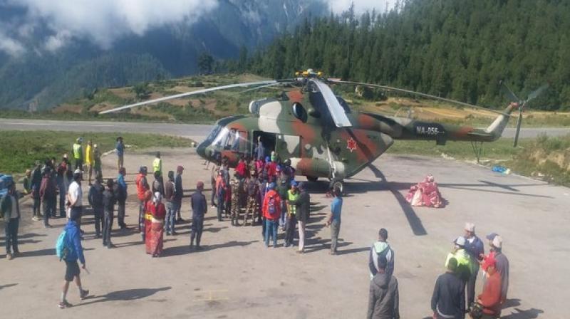On Thursday, the Ministry of External Affairs (MEA) had announced that 883 pilgrims, who had been stranded due to inclement weather, have been evacuated from Simikot to Surkhet and Nepalganj in the last three days. (Photo: ANI)