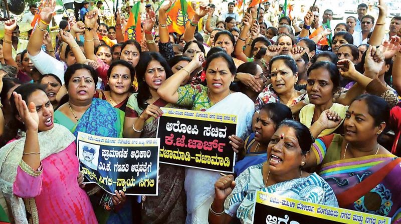 BJP Mahila Morcha members led by Udupi-Chikkamagaluru MP Shobha Karandlaje stage a protest in Bengaluru on Monday demanding the resignation of Bengaluru development minister K.J. George for his alleged involvement in the DySP Ganapathi suicide.