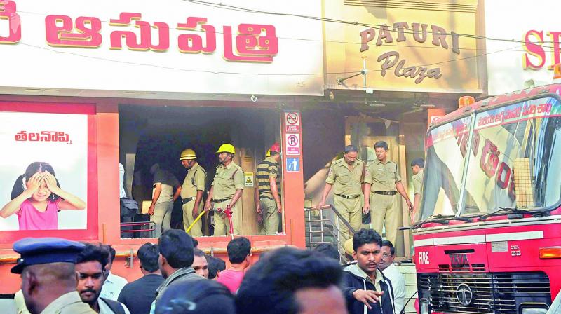 Fire personnel control the flames at Eye Hospital at Nakkal Road in Vijayawada on Wednesday. (Photo: DC)