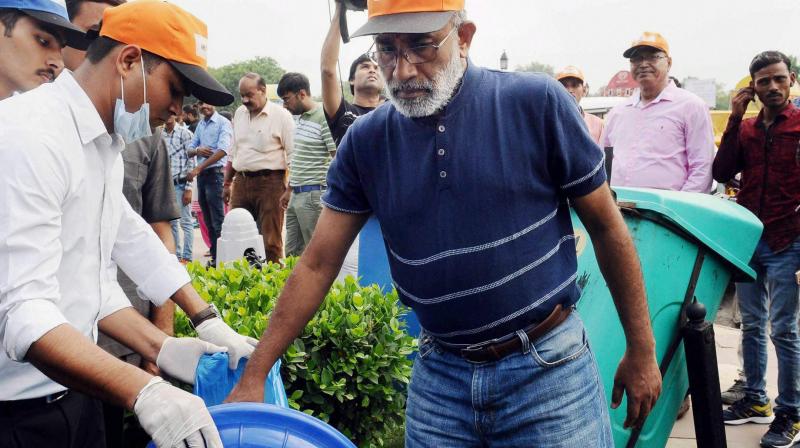 Minister of State for Tourism (I/C) and Electronics & Information Technology, Alphons Kannanthanam participating in a cleanliness drive as part of Swachhta Hi Sewa campaign, organised by Ministry of Tourism, in New Delhi on Sunday. (Photo: