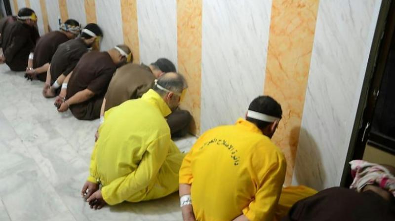 A picture released by the Iraqi justice ministry on June 29, 2018 shows a group of convicted jihadists awaiting execution. (Photo: AFP)