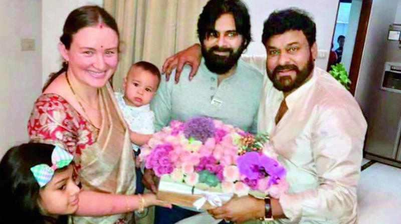 Pawan Kalyan and wife Anna Lezhneva at Chiranjeevis residence.  Polena and Mark Shankar Pawanovich are also seen in the picture.