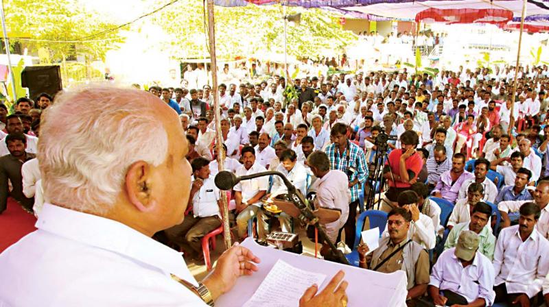 BJP state president and former CM B.S. Yeddyurappa addressing a public meeting in poll-bound Nanjangud on Monday