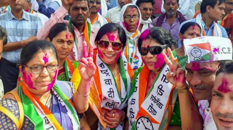 NCP workers celebrate their partys success in BhandaraGondiya Loksabha by-elections, outside their party office, in Bhandara district of Maharashtra on Thursday. (Photo: PTI)