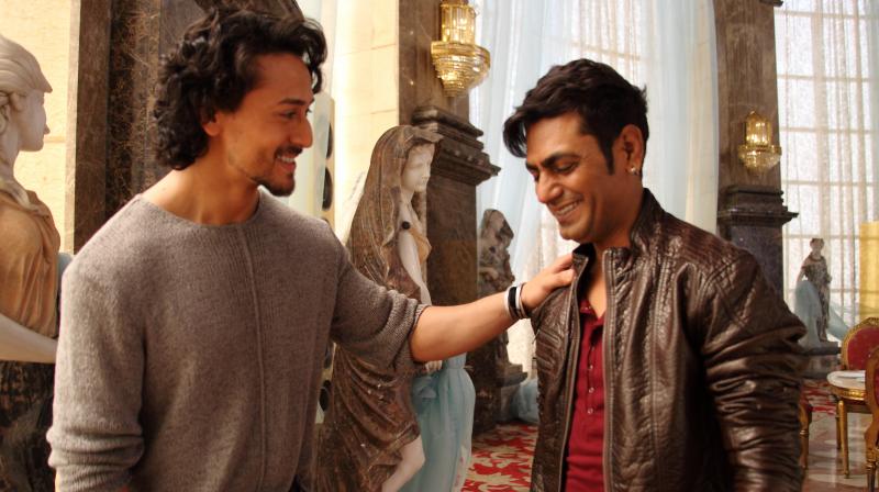 Tiger and Nawazuddin share a light moment while filming Munna Michael.